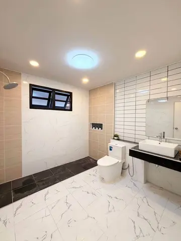 Second bathroom with mixed wall tiles and a white marble-look floor