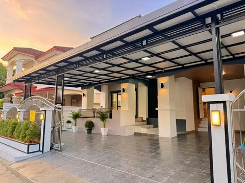 Covered carport and the ground-floor entrance