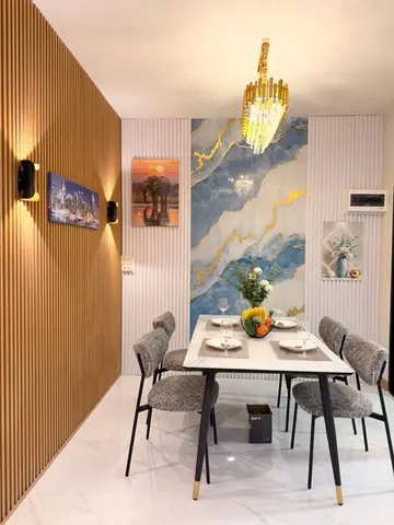 Dining corner beside the slatted wall. The table and chairs shown are staging